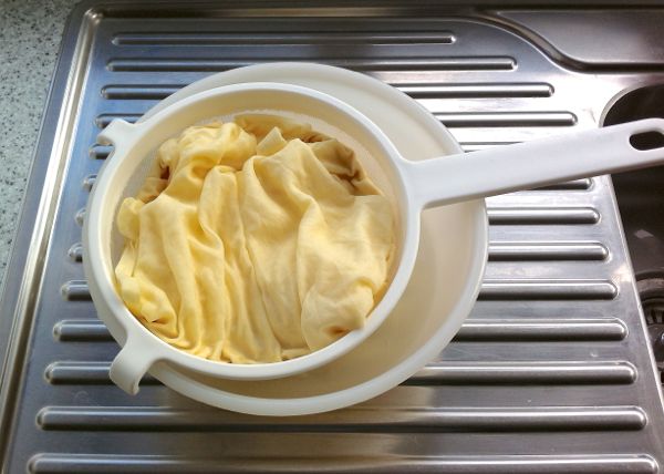 strain quinoa yoghurt through muslin